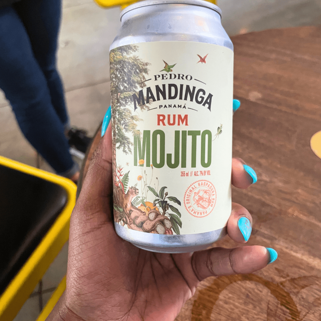 Can of Pedro Mandinga rum mojito being held by brown hand. 